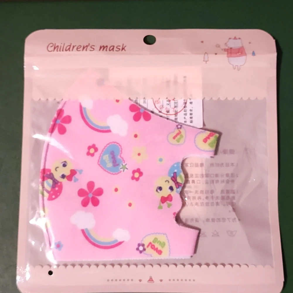 Children's re Usable face mask new in package never opened